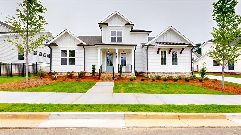 a front view of a house with a yard