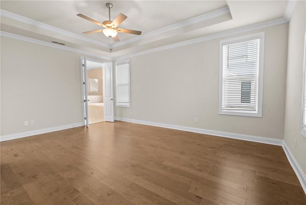 579 Pearl Street Cumming, GA 30040 - Photo 14 of 30 wooden floor in an empty room with a window