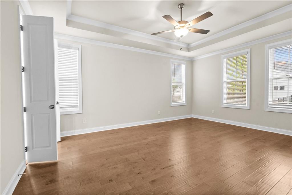 579 Pearl Street Cumming, GA 30040 - Photo 16 of 30 wooden floor in an empty room with a window