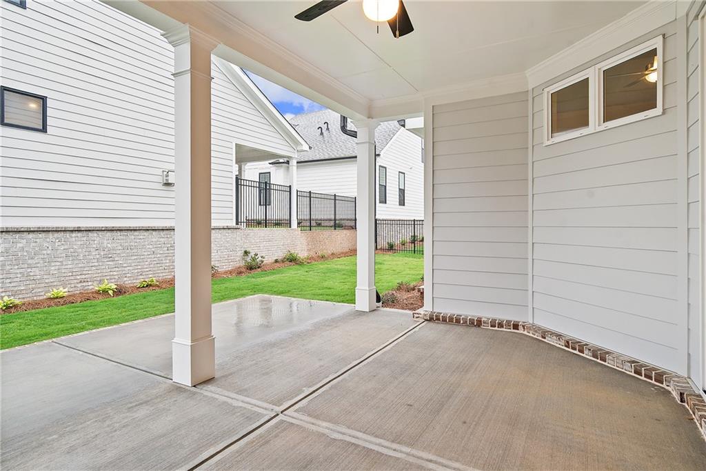 579 Pearl Street Cumming, GA 30040 - Photo 23 of 30 a view of a house with a yard and garage