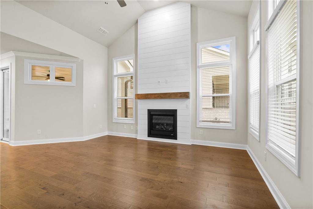 579 Pearl Street Cumming, GA 30040 - Photo 4 of 30 a view of an empty room with window and fire place