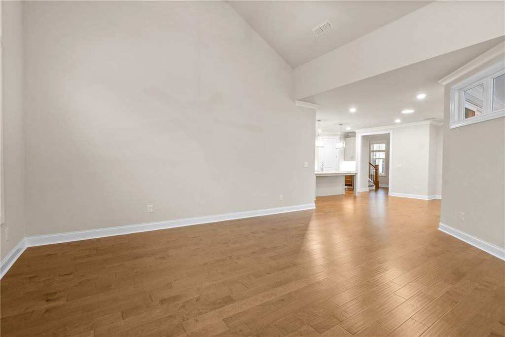 579 Pearl Street Cumming, GA 30040 - Photo 5 of 30 a view of empty room with wooden floor