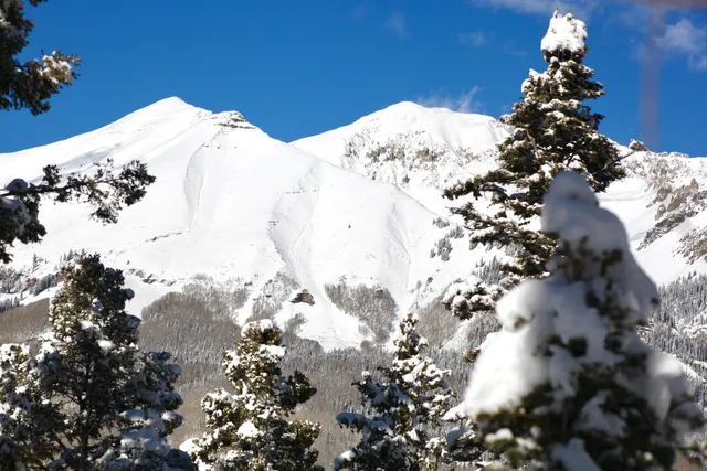 a view of a snow on the road