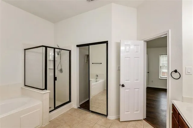 a view of a bathroom with mirror