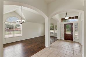 9914 Golden Rod Drive Frisco, TX 75035 - Photo 3 of 18 a view of a livingroom with a chandelier fan and fire place