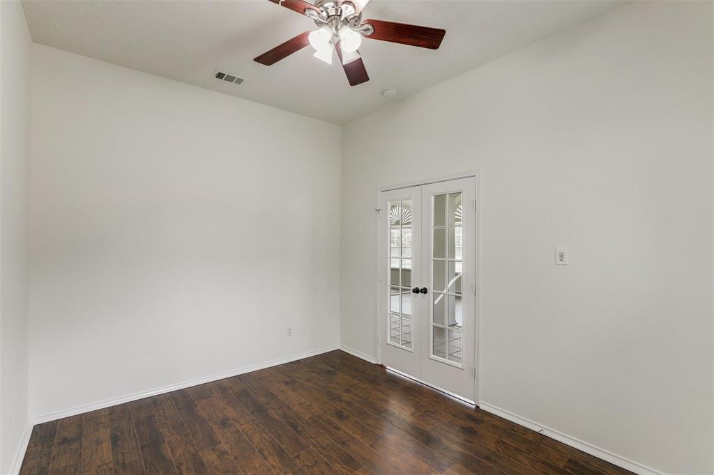 9914 Golden Rod Drive Frisco, TX 75035 - Photo 5 of 18 an empty room with wooden floor closet and windows