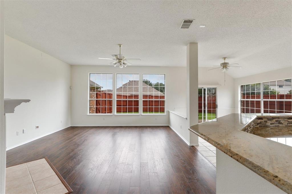 9914 Golden Rod Drive Frisco, TX 75035 - Photo 10 of 18 a view of an empty room with wooden floor and a window