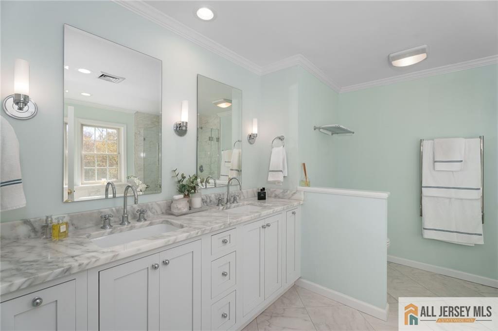 213 Cranbury Neck Road Plainsboro, NJ 08512 - Photo 18 of 52 a bathroom with a granite countertop sink and a mirror