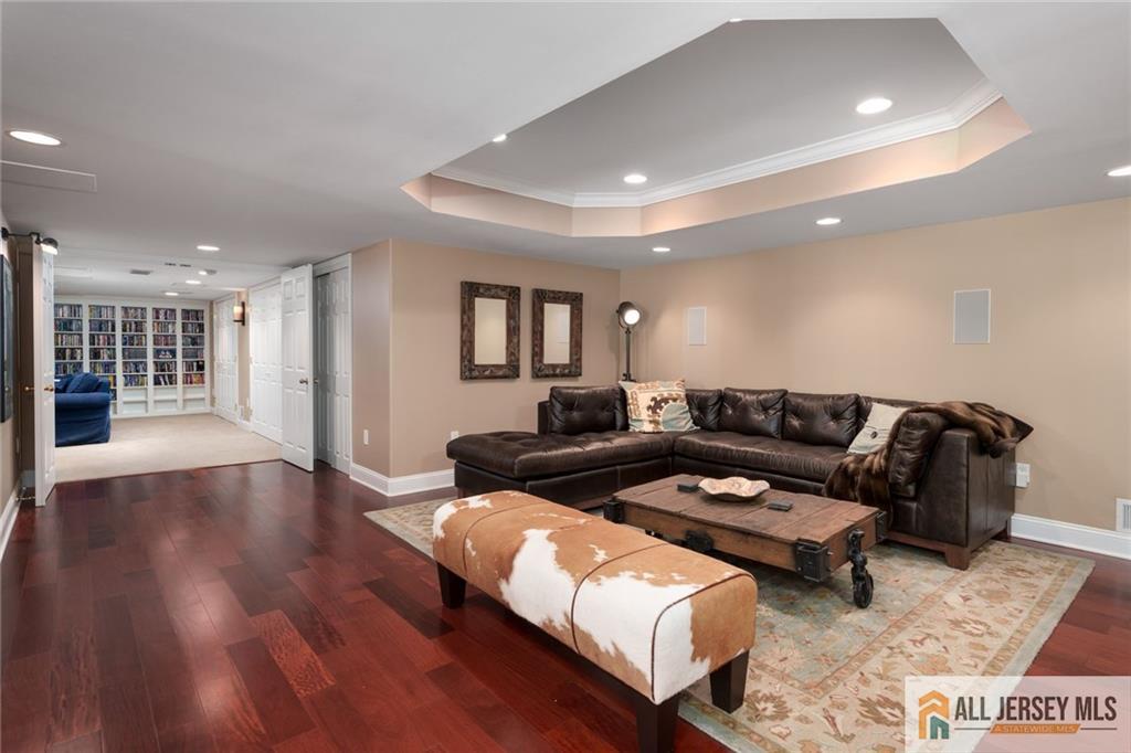 213 Cranbury Neck Road Plainsboro, NJ 08512 - Photo 27 of 52 a living room with furniture and wooden floor