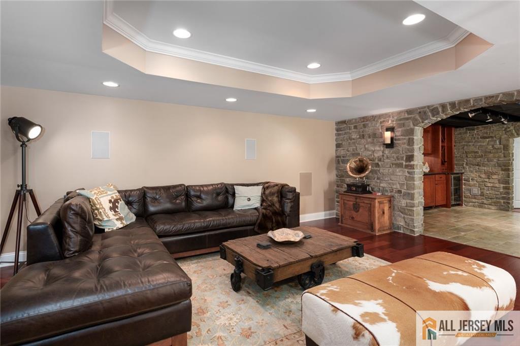 213 Cranbury Neck Road Plainsboro, NJ 08512 - Photo 28 of 52 a living room with furniture and a wooden floor