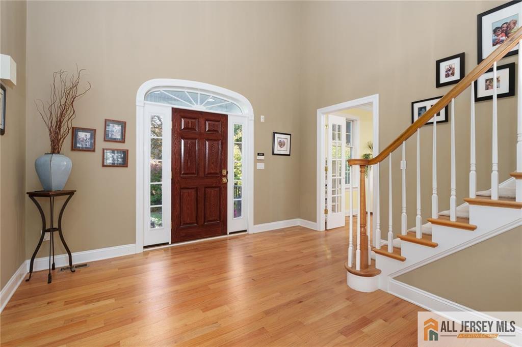 213 Cranbury Neck Road Plainsboro, NJ 08512 - Photo 3 of 52 a view of an entryway with wooden floor