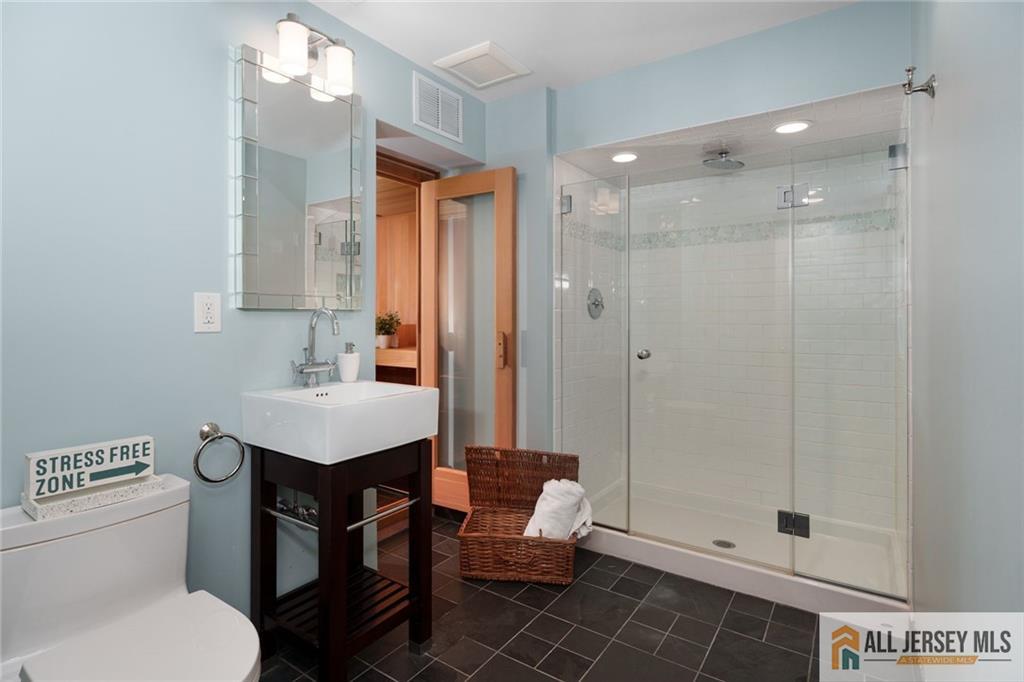 213 Cranbury Neck Road Plainsboro, NJ 08512 - Photo 31 of 52 a bathroom with a sink toilet and shower