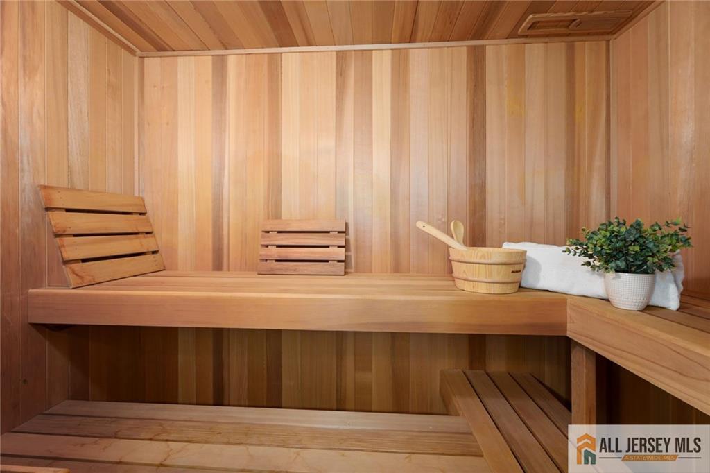 213 Cranbury Neck Road Plainsboro, NJ 08512 - Photo 32 of 52 a close view of wooden cabinets and a chair