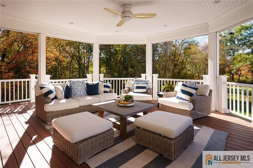 213 Cranbury Neck Road Plainsboro, NJ 08512 - Photo 34 of 52 a living room with furniture and large windows