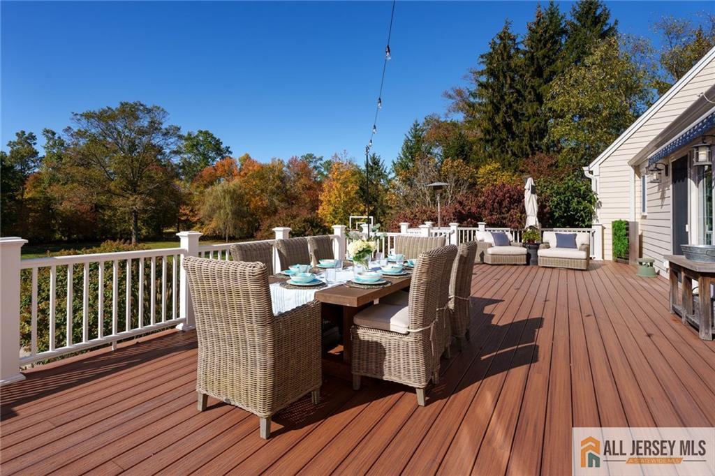 213 Cranbury Neck Road Plainsboro, NJ 08512 - Photo 36 of 52 a view of a roof deck with wooden floor and fence