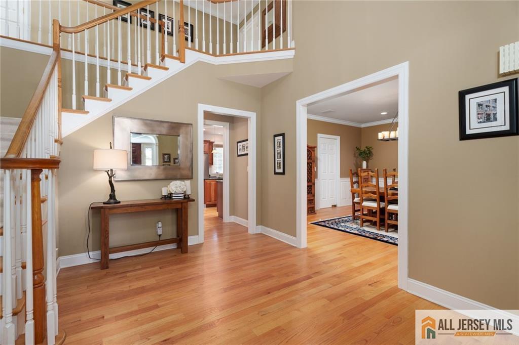 213 Cranbury Neck Road Plainsboro, NJ 08512 - Photo 4 of 52 a view of kitchen with furniture and a wooden floor