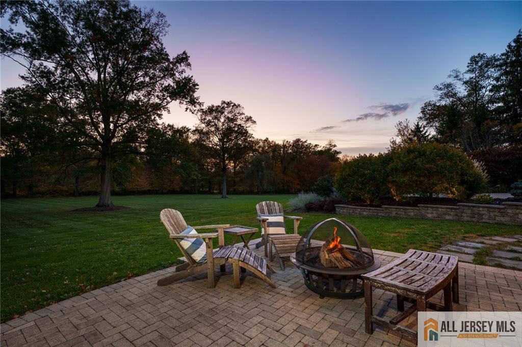 213 Cranbury Neck Road Plainsboro, NJ 08512 - Photo 50 of 52 a view of a table and chairs in the garden