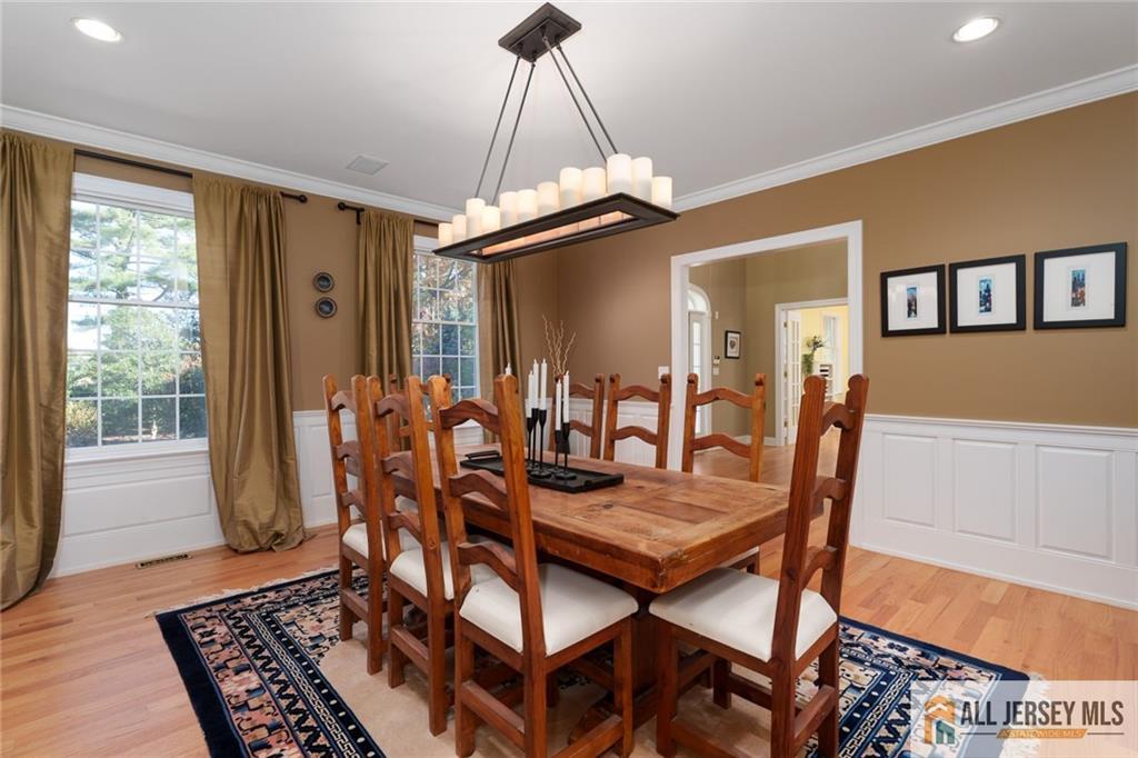 213 Cranbury Neck Road Plainsboro, NJ 08512 - Photo 5 of 52 a view of a dining room with furniture and wooden floor