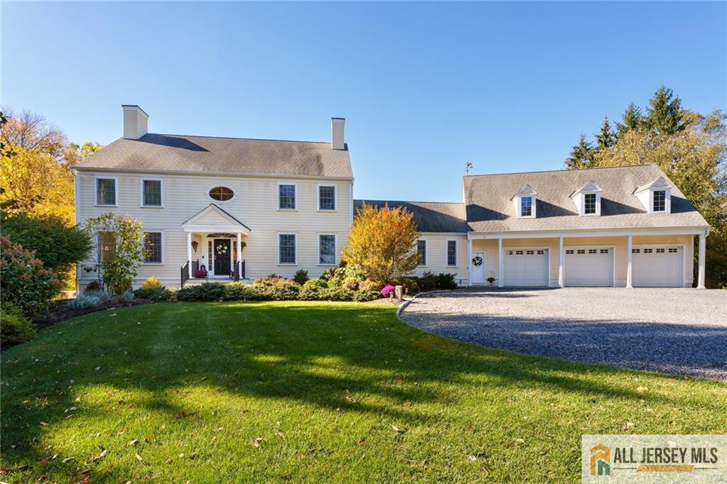 213 Cranbury Neck Road Plainsboro, NJ 08512 - Photo 52 of 52 a view of a white house with a big yard and potted plants