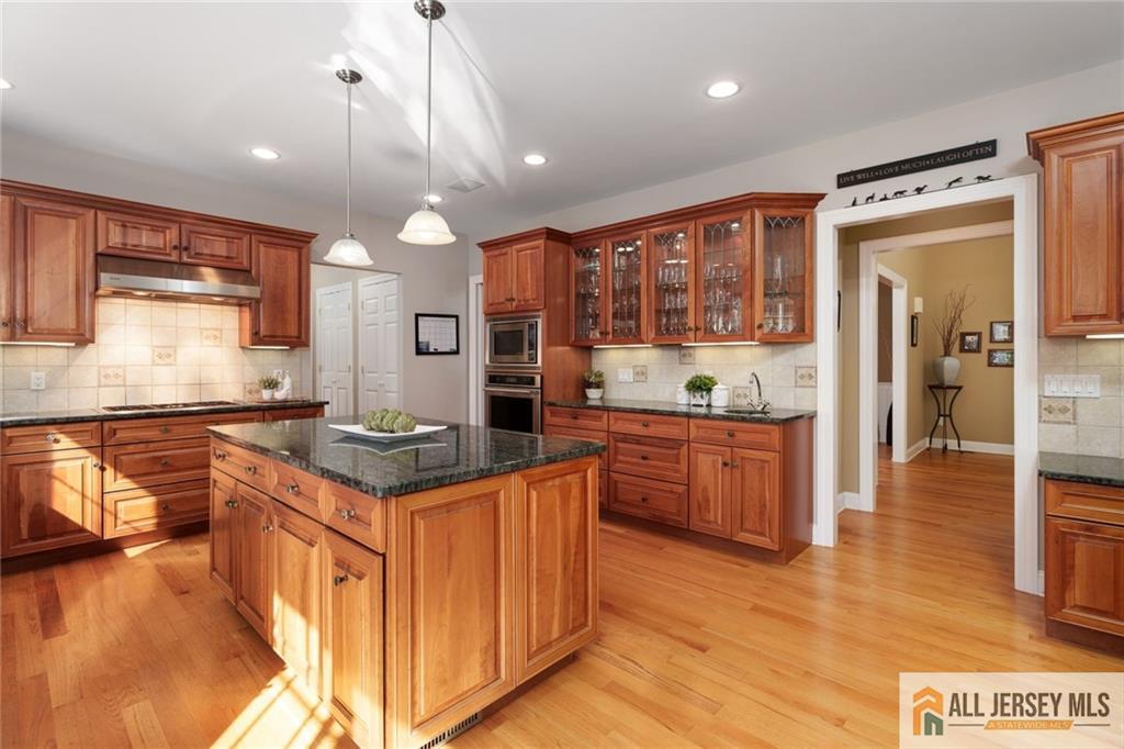 213 Cranbury Neck Road Plainsboro, NJ 08512 - Photo 6 of 52 a kitchen with stainless steel appliances granite countertop a stove and a refrigerator