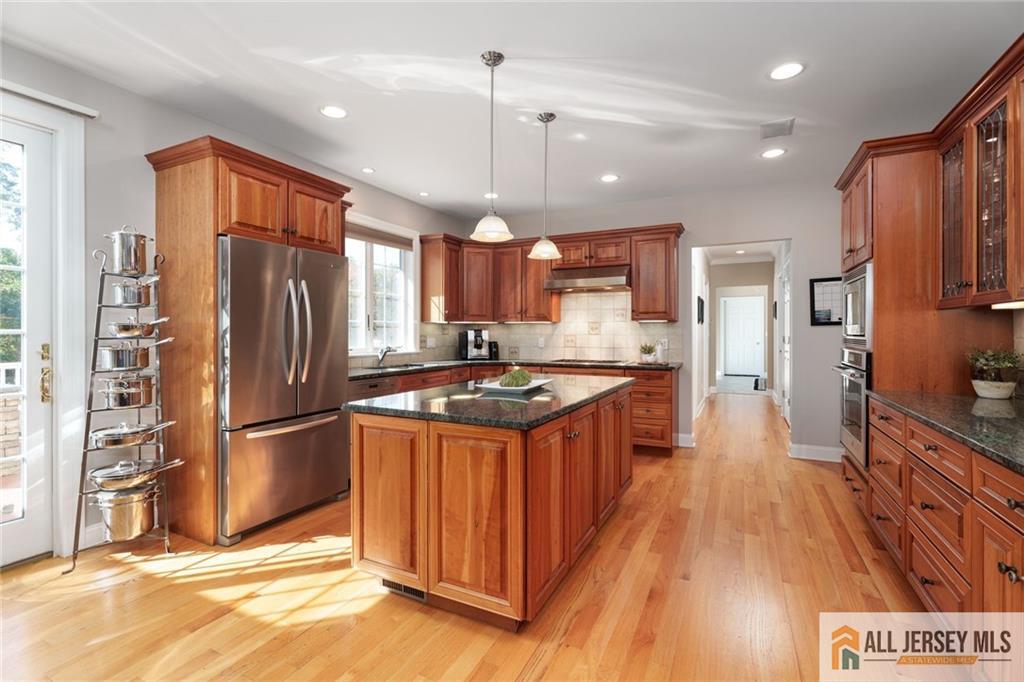 213 Cranbury Neck Road Plainsboro, NJ 08512 - Photo 7 of 52 a kitchen with stainless steel appliances granite countertop a refrigerator a stove a sink dishwasher and a refrigerator