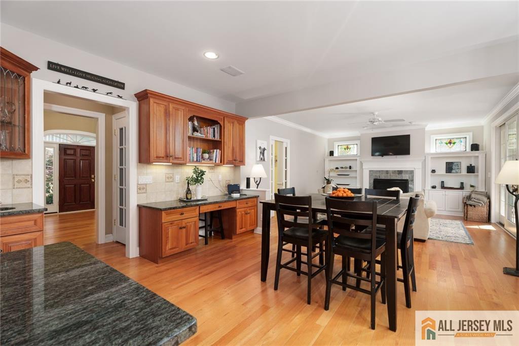 213 Cranbury Neck Road Plainsboro, NJ 08512 - Photo 9 of 52 a view of dining table chairs and granite counter top