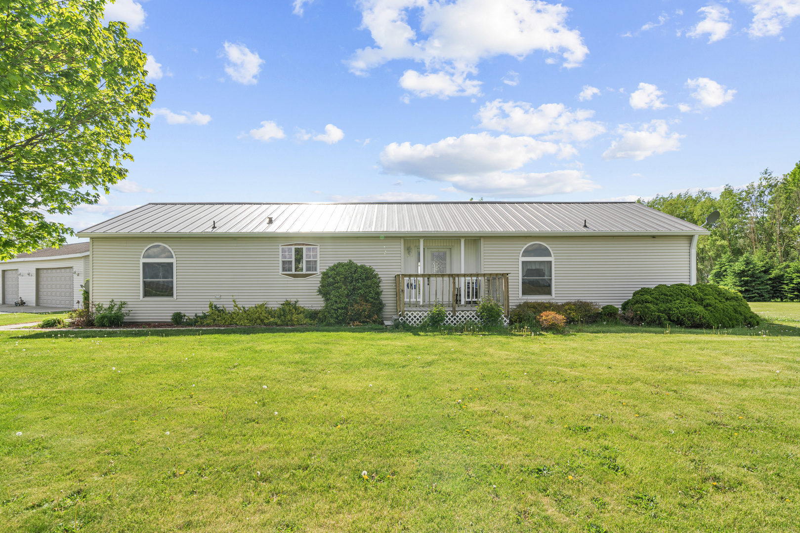 627 German Road Paw Paw, IL 61353 - Photo 1 of 45 a view of a house with a big yard and potted plants