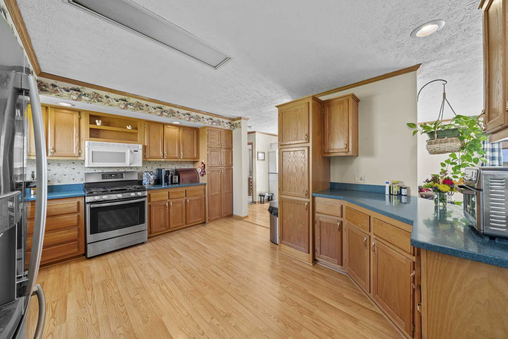 627 German Road Paw Paw, IL 61353 - Photo 13 of 45 a kitchen with stainless steel appliances a stove top oven