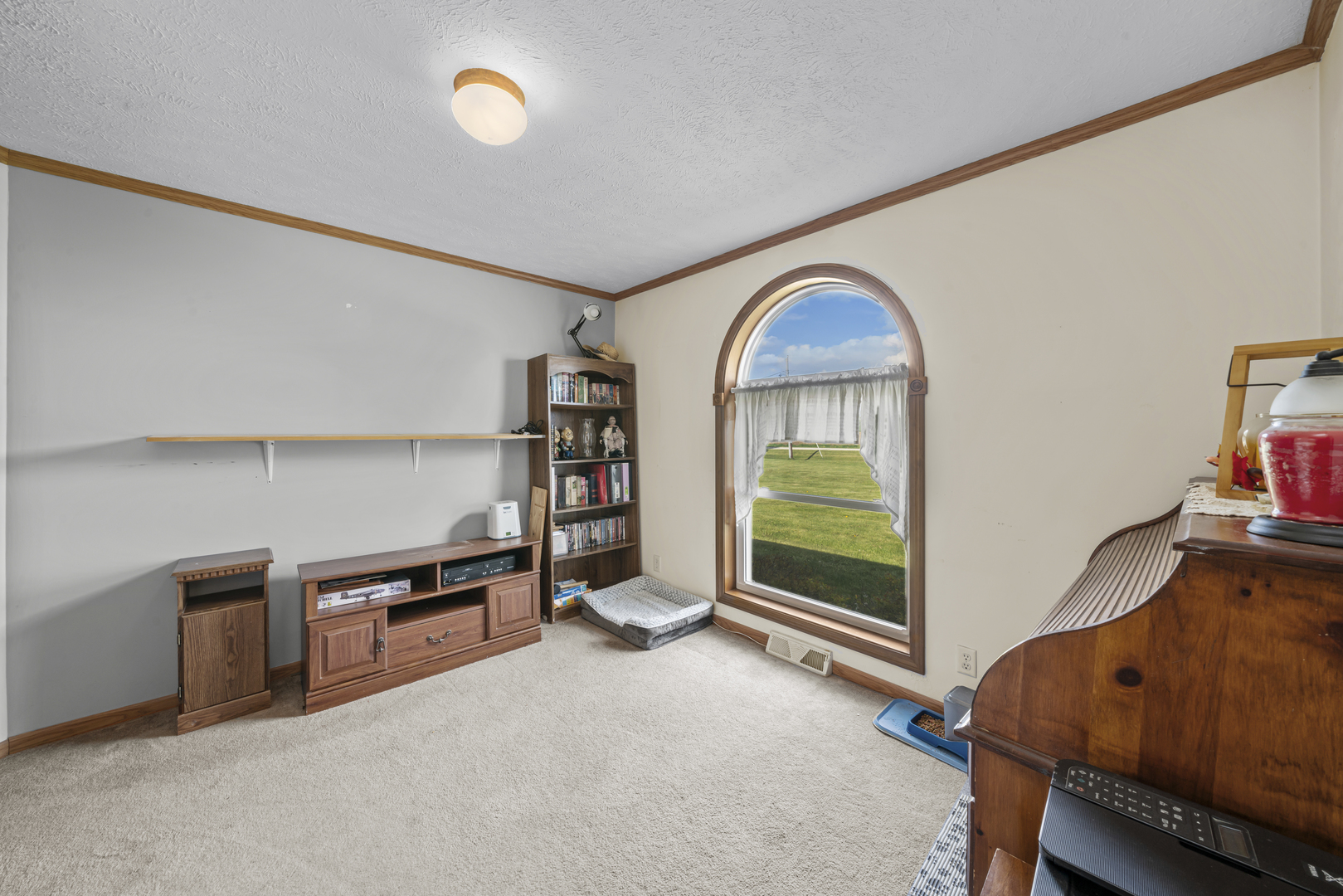 627 German Road Paw Paw, IL 61353 - Photo 20 of 45 a living room with furniture and a book shelf