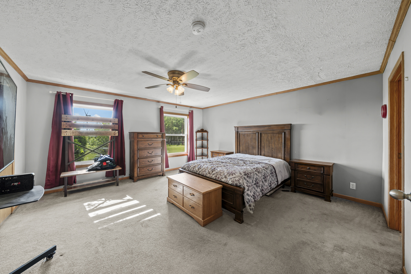 627 German Road Paw Paw, IL 61353 - Photo 21 of 45 a spacious bedroom with a bed and a chandelier