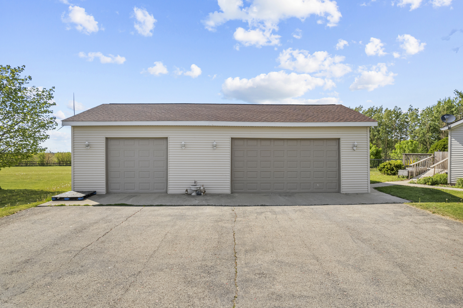 627 German Road Paw Paw, IL 61353 - Photo 39 of 45 a front view of a house with a yard and garage