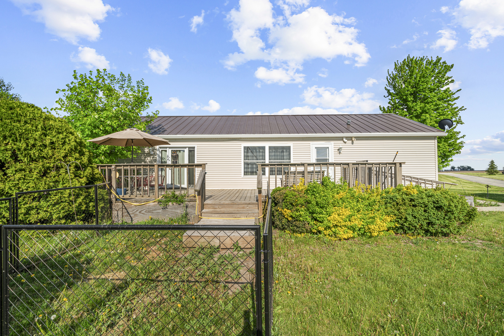 627 German Road Paw Paw, IL 61353 - Photo 5 of 45 a front view of a house with a yard