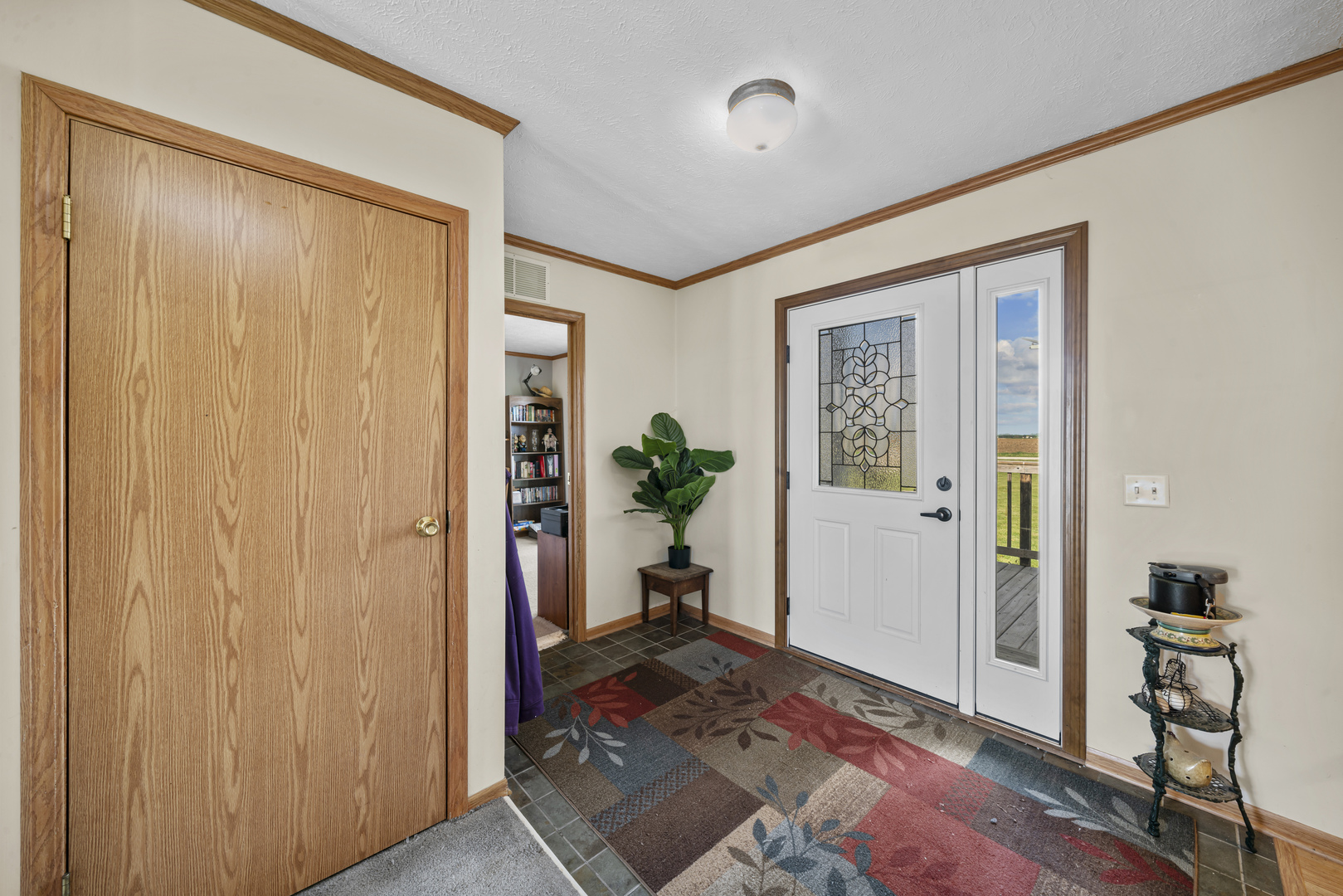 627 German Road Paw Paw, IL 61353 - Photo 7 of 45 a view of a hallway with bathroom and wooden floor