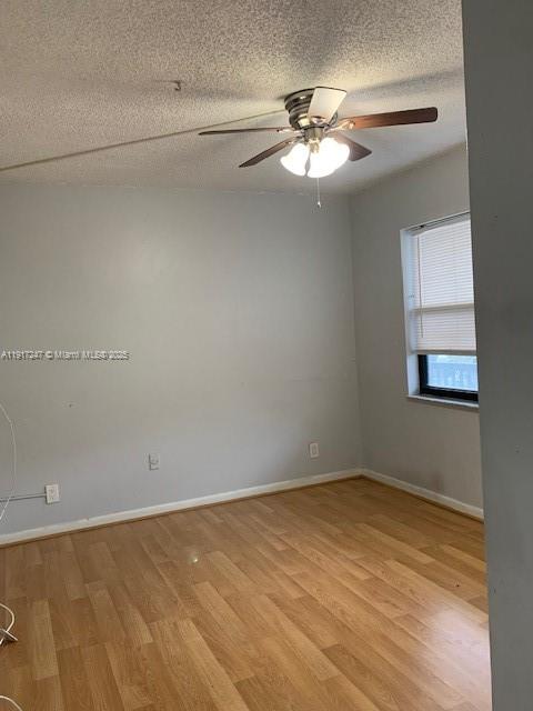 Delray Beach Delray Beach, FL 33445 - Photo 4 of 20 an empty room with a chandelier fan