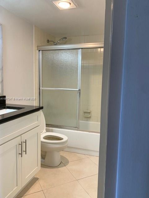 Delray Beach Delray Beach, FL 33445 - Photo 5 of 20 a bathroom with a granite countertop toilet and a sink