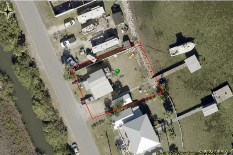 303 River Road Oak Hill, FL 32759 - Photo 2 of 5 an aerial view of a house with outdoor space