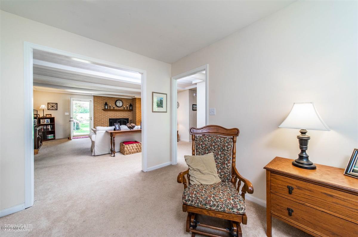 245 Plentitude Church Road Gray, GA 31032 - Photo 11 of 31 a bedroom with furniture and a lamp