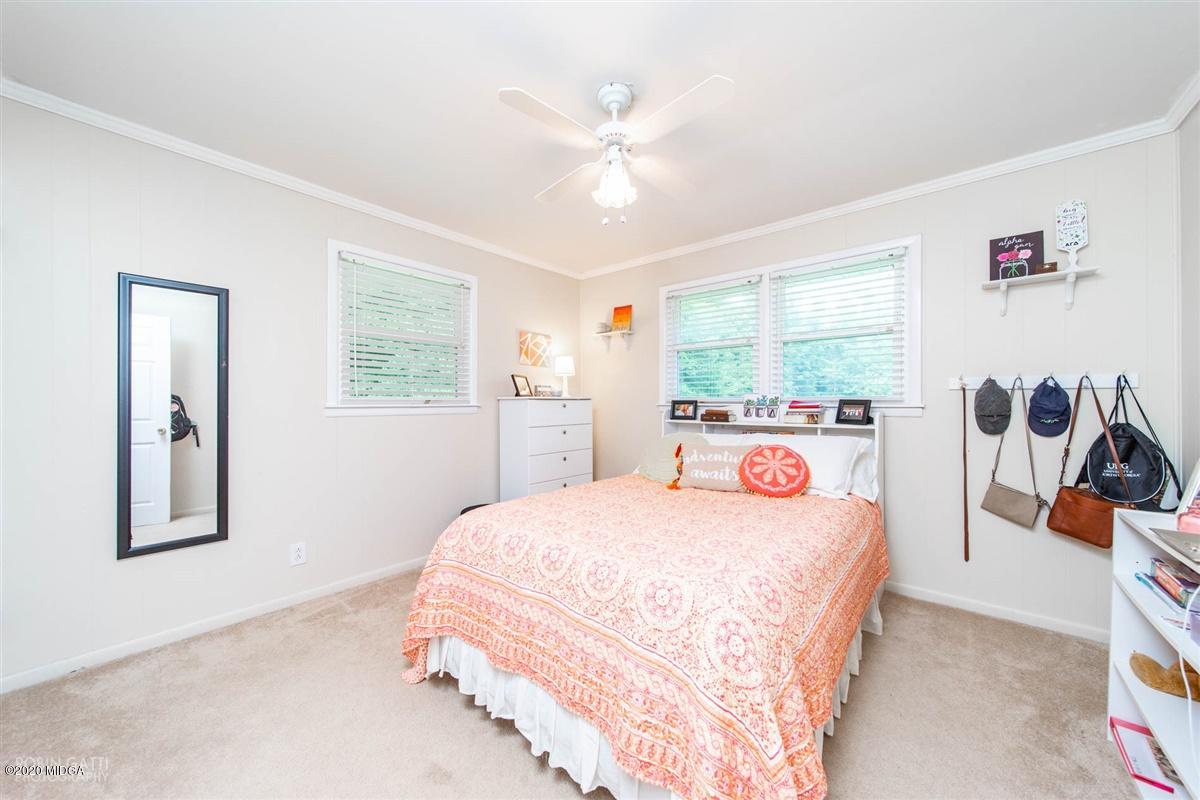 245 Plentitude Church Road Gray, GA 31032 - Photo 13 of 31 a bedroom with a large bed and a large window