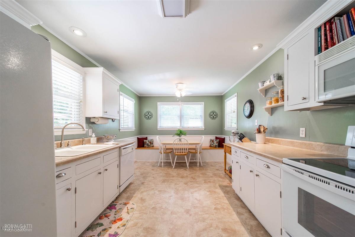 245 Plentitude Church Road Gray, GA 31032 - Photo 23 of 31 a large white kitchen with a window
