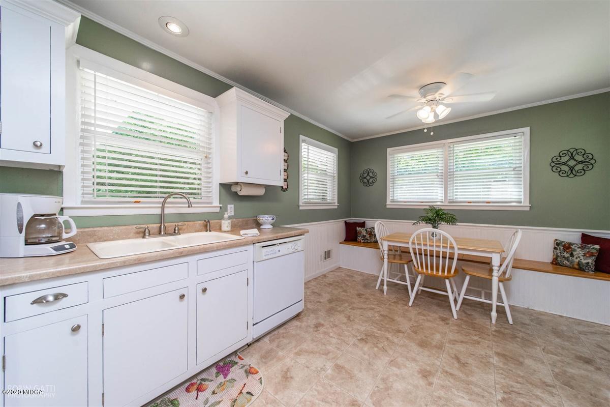 245 Plentitude Church Road Gray, GA 31032 - Photo 24 of 31 a kitchen with a dining table chairs and large window