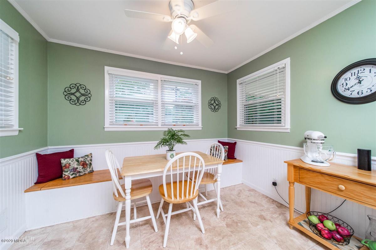 245 Plentitude Church Road Gray, GA 31032 - Photo 25 of 31 a dining room with furniture a rug and a chandelier