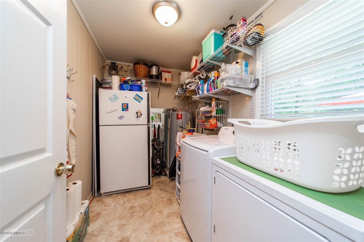 245 Plentitude Church Road Gray, GA 31032 - Photo 29 of 31 a utility room with dryer and washer