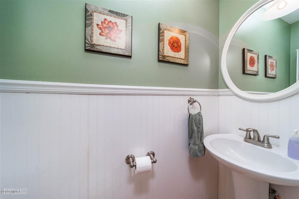 245 Plentitude Church Road Gray, GA 31032 - Photo 30 of 31 a bathroom with a sink and a mirror