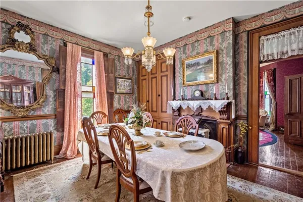 a view of a dining room with furniture window and wooden floor