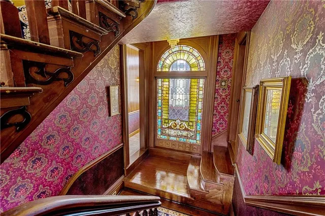 a bath tub sitting in a bathroom next to a window