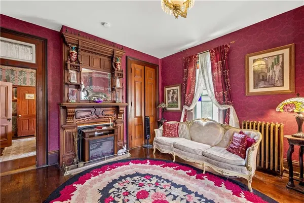 a living room with furniture and a book shelf