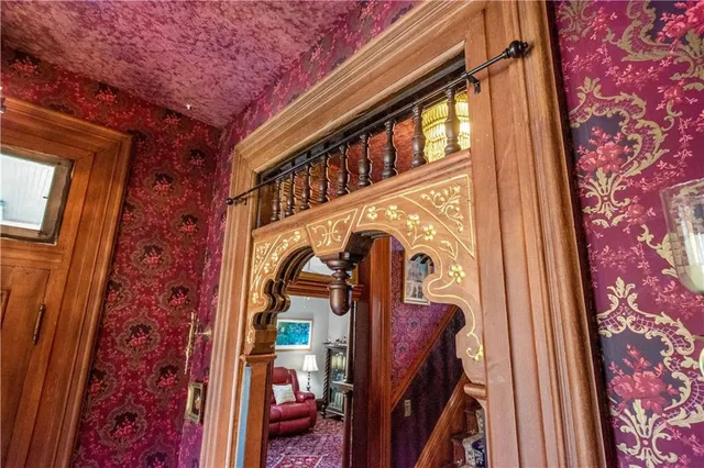 a view of a dining room with furniture and chandelier