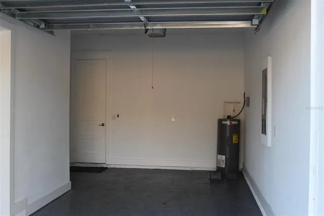 a kitchen with stainless steel appliances kitchen island granite countertop a refrigerator and a stove top oven