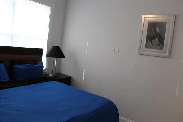 a room with a window and a wooden floor