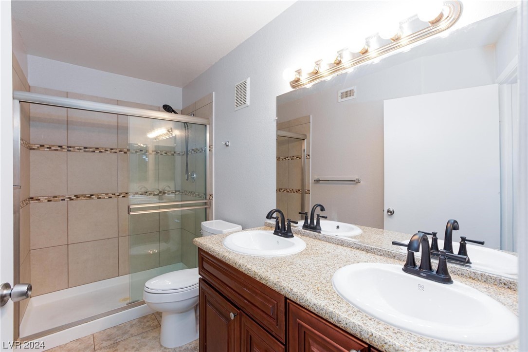 7950 West Flamingo Road, Unit 2072 Las Vegas, NV 89147 - Photo 23 of 36 master bath dual sink, tile, granite counter tops